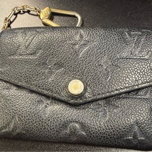 Louis Vuitton Textured Black Clutch with Gold Accents